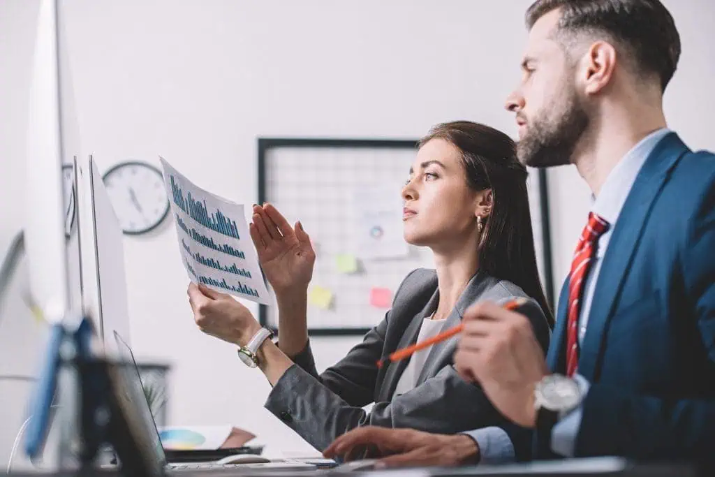 side view of data analysts using charts while asse 2022 12 16 21 16 25 utc min