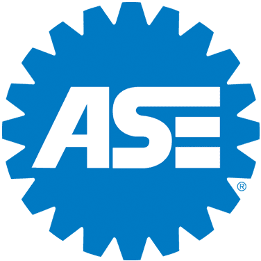 ASE certified mechanic working on a car engine at Ed's Auto Repair.