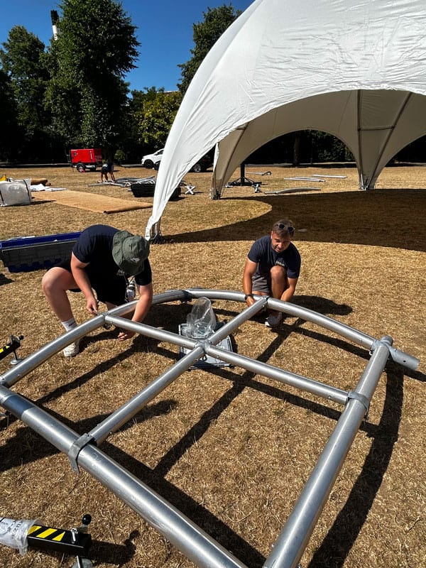 two men working on a structure
