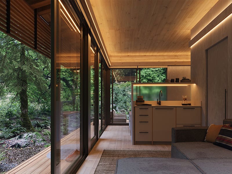 Modern compact kitchen with minimalist design and natural wood elements, seamlessly connected to a lush outdoor forest view. Ideal for eco-friendly living and nature-inspired interiors.