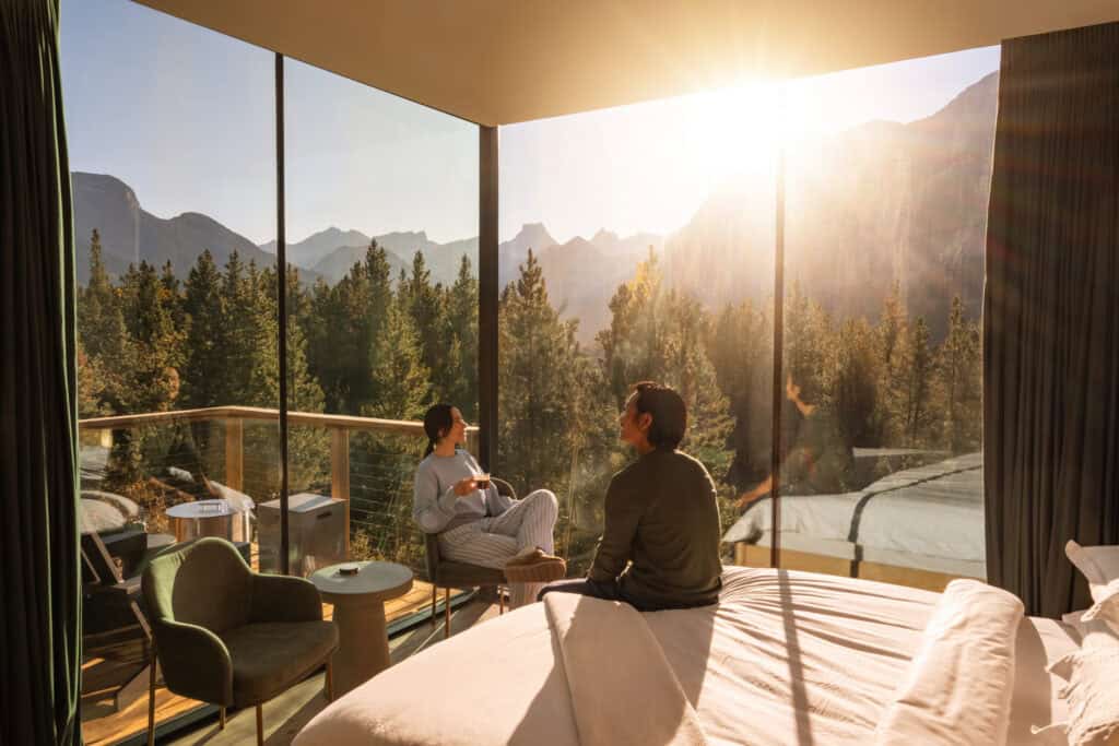 Bright tiny home with large glass windows overlooking mountains and forest. Perfect for minimalist living and outdoor enthusiasts seeking a peaceful retreat.