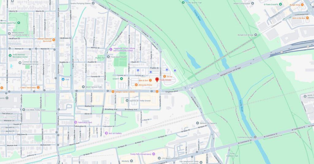 Map of a city highlighting streets, parks, and rivers for navigation and urban planning.