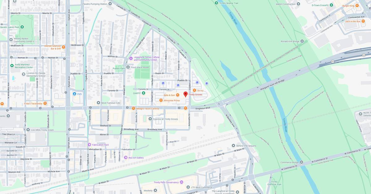 Map of a city highlighting streets, parks, and rivers for navigation and urban planning.