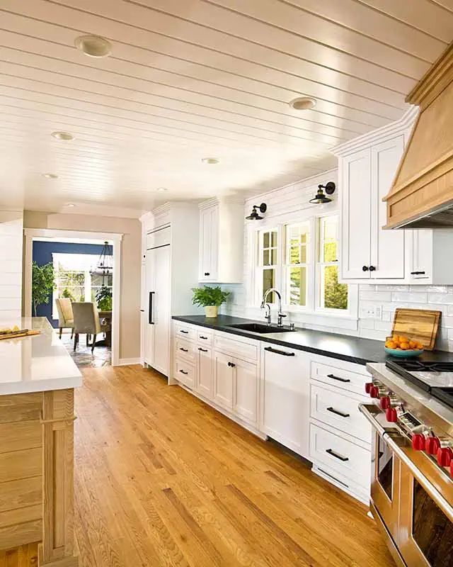 White and airy kitchen remodel by Elik Homes.