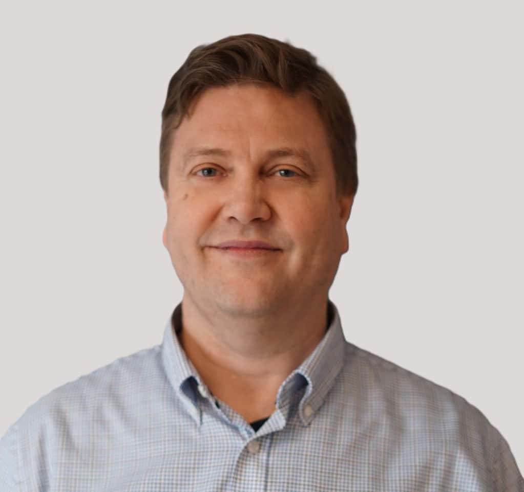 A man in a blue shirt and white shirt.