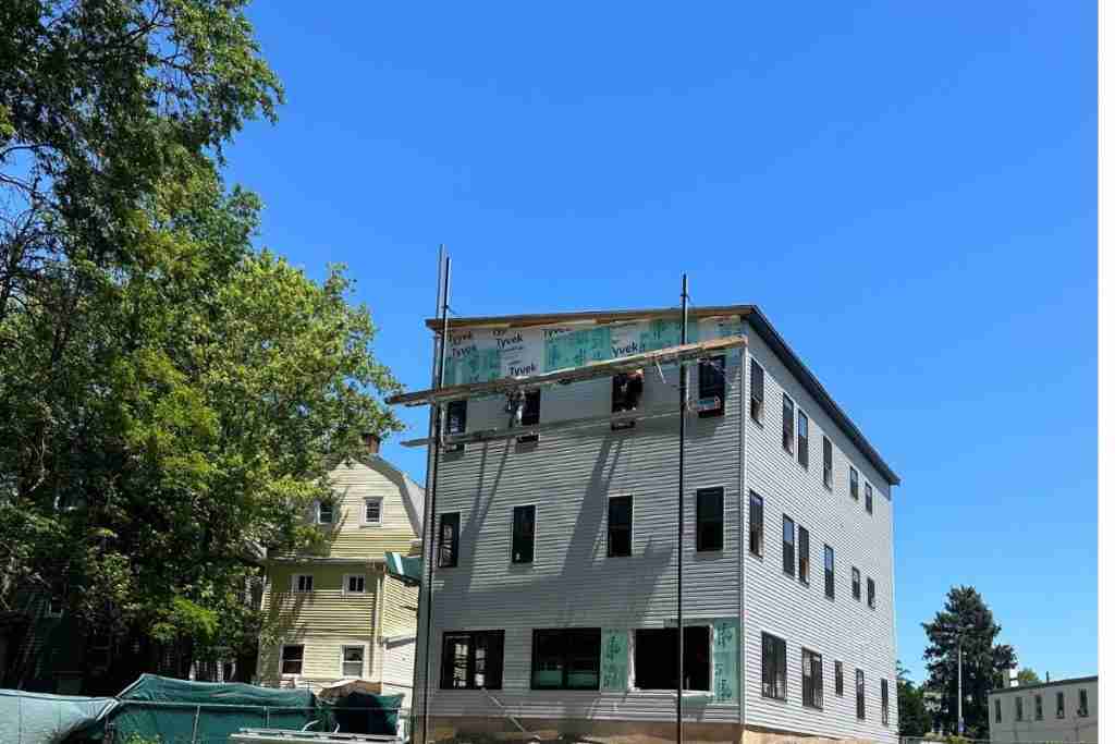 New vinyl siding project with white trim in Newark, NJ