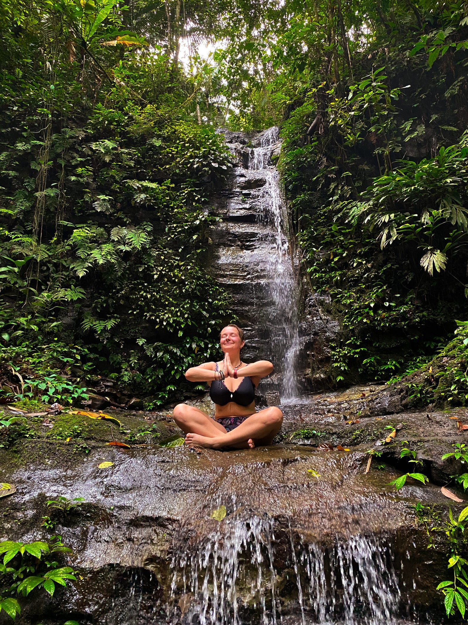 Jungle retreat, woman doing yoga