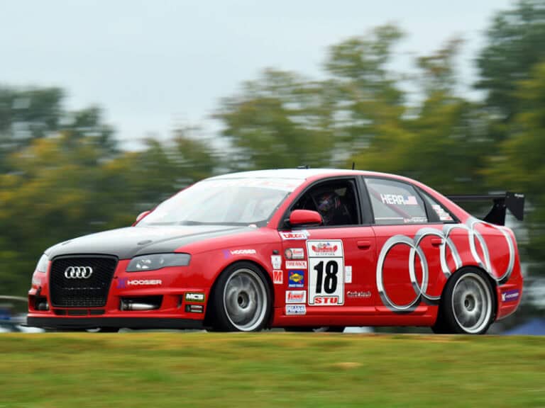 Chip Herr a professional racing driver proudly using Ecorsa Motorsport oil in Championship Vehicle.