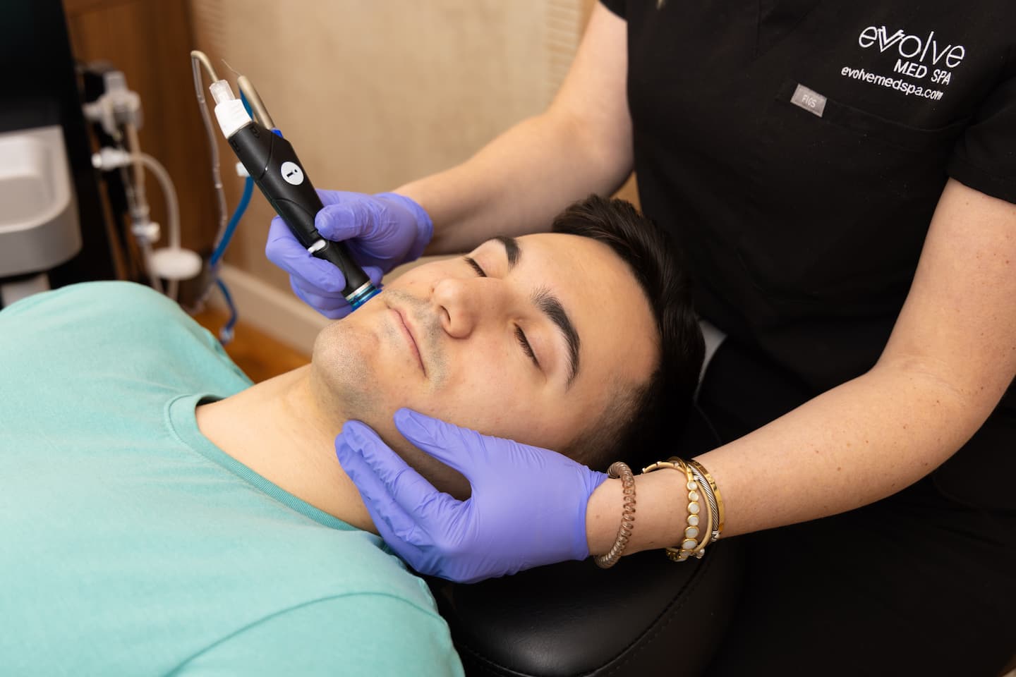 Men receiving a skin care treatment at Evolve Med Spa