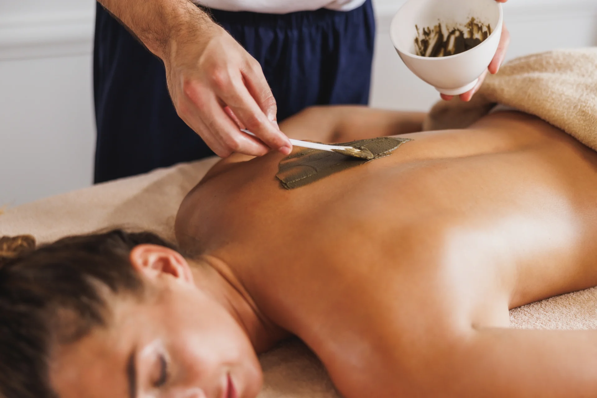 Chemical peel compound being administered for back facial