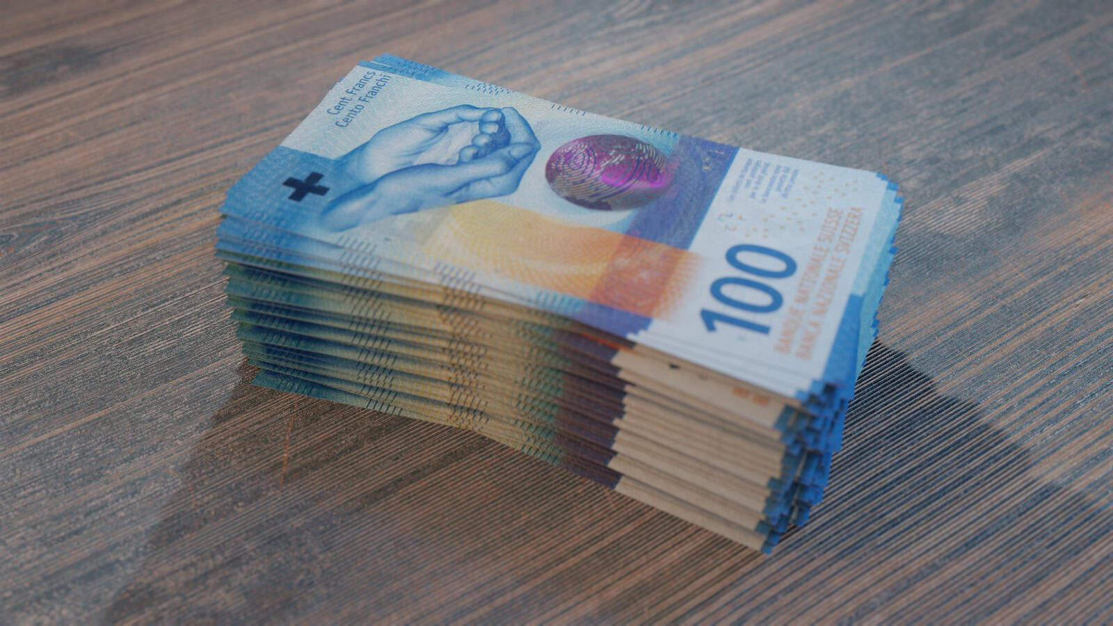 Frau hält verschiedene Scheine Schweizer Franken in der Hand