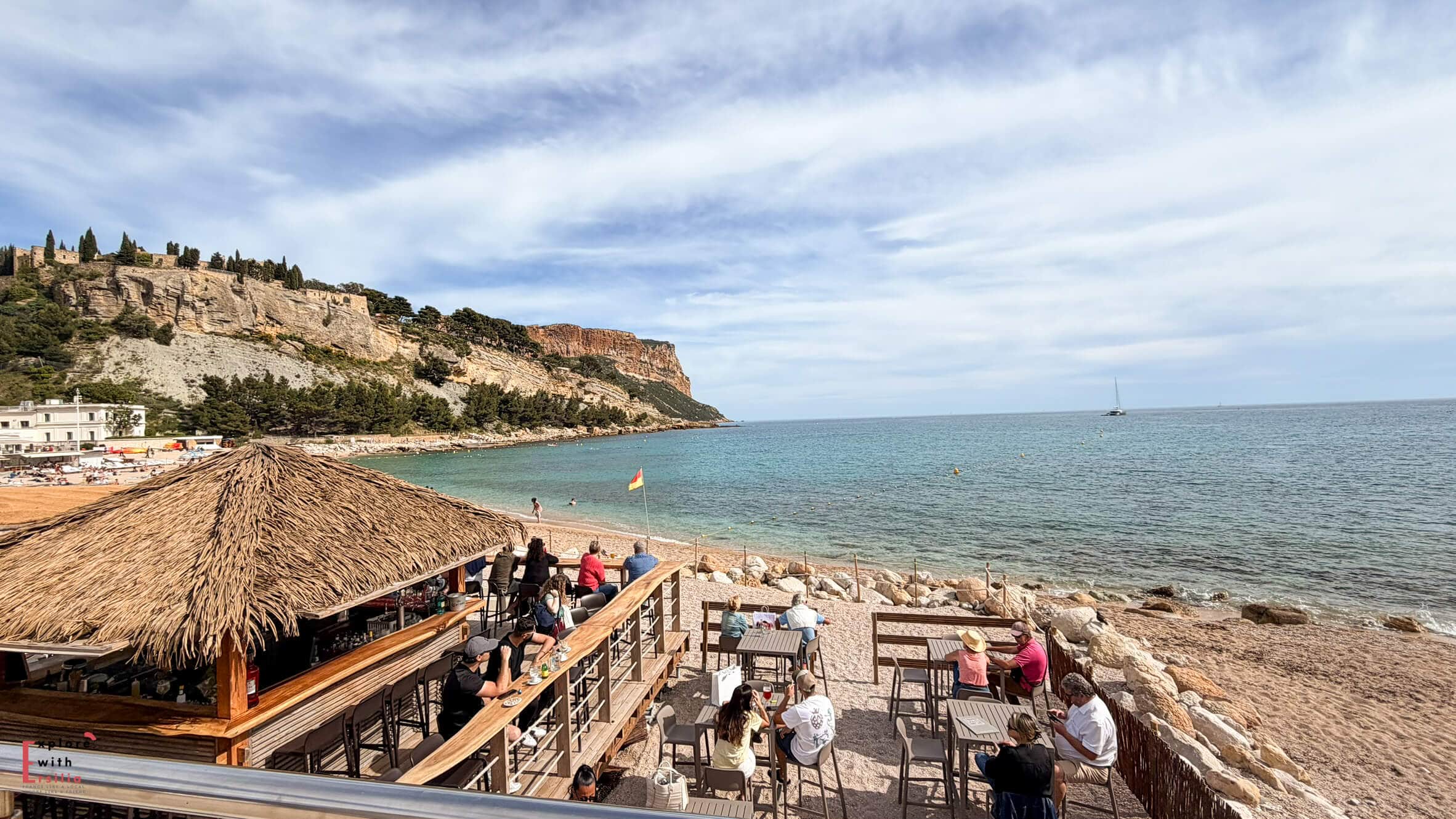 Plage de la Grande Mer with beachgoers relaxing on the sand and the Mediterranean Sea stretching into the distance.
