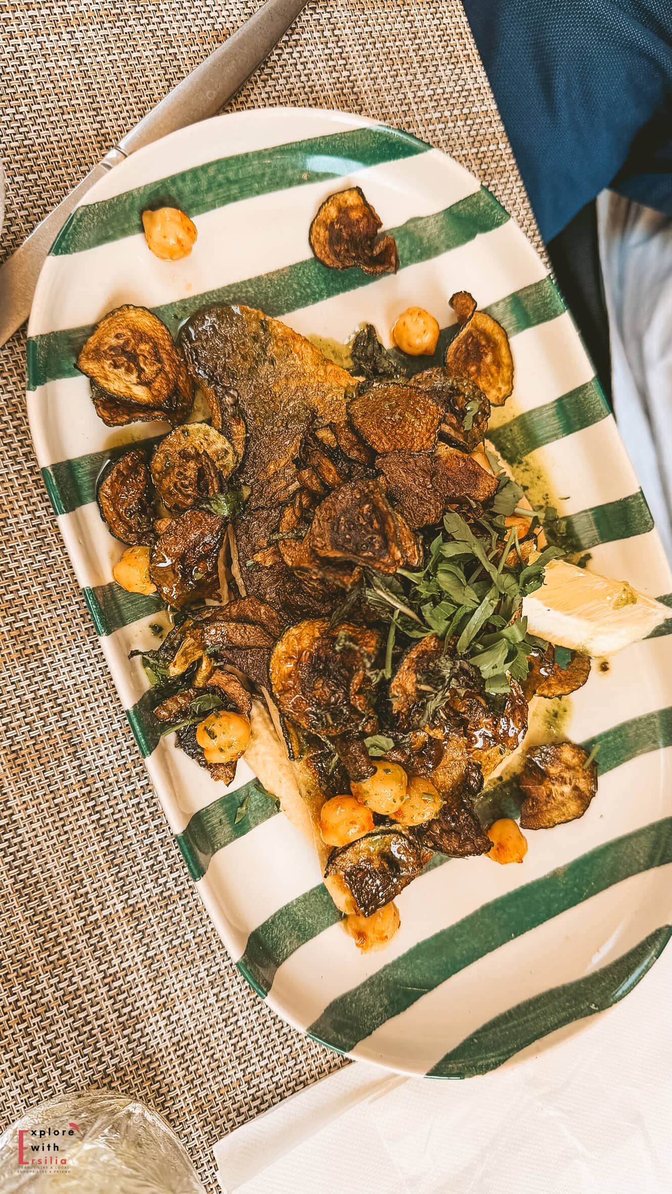 Fresh fish entrée served with vegetables at a restaurant in Cassis.