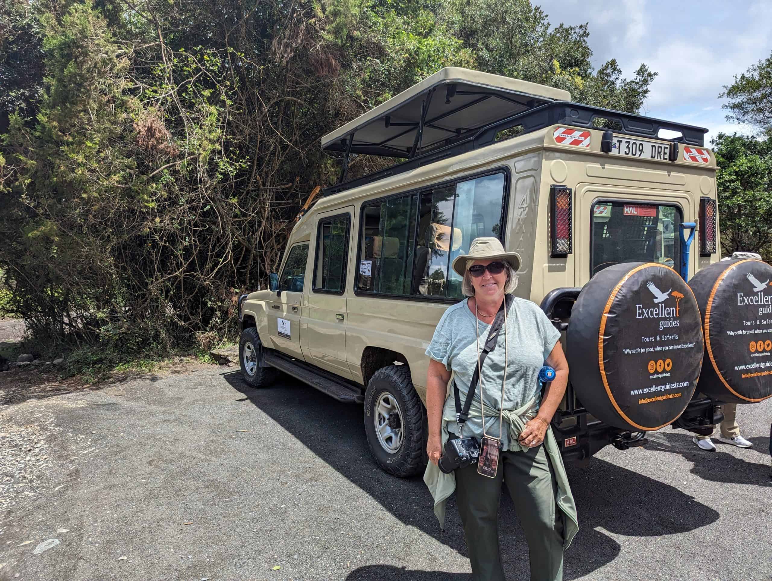 Kim in front of the safari vehicles
