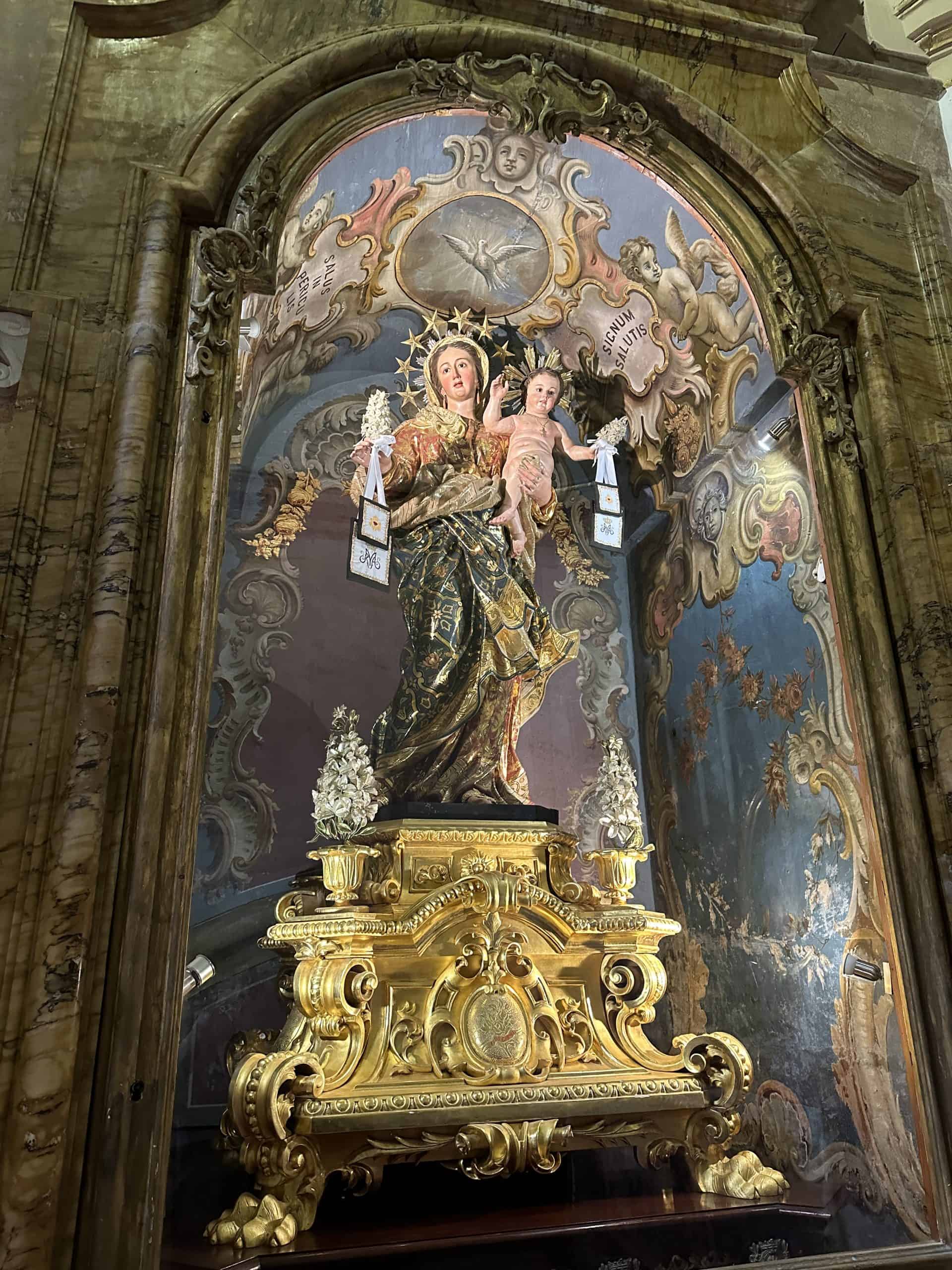 Beautiful gold statue of the Virgin Mary inside the church