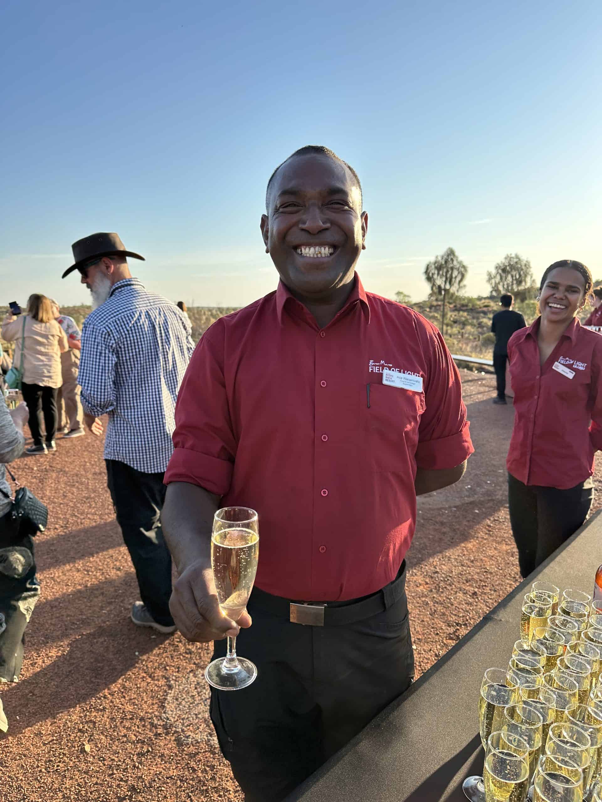 Friendly staff serving sparkling wine