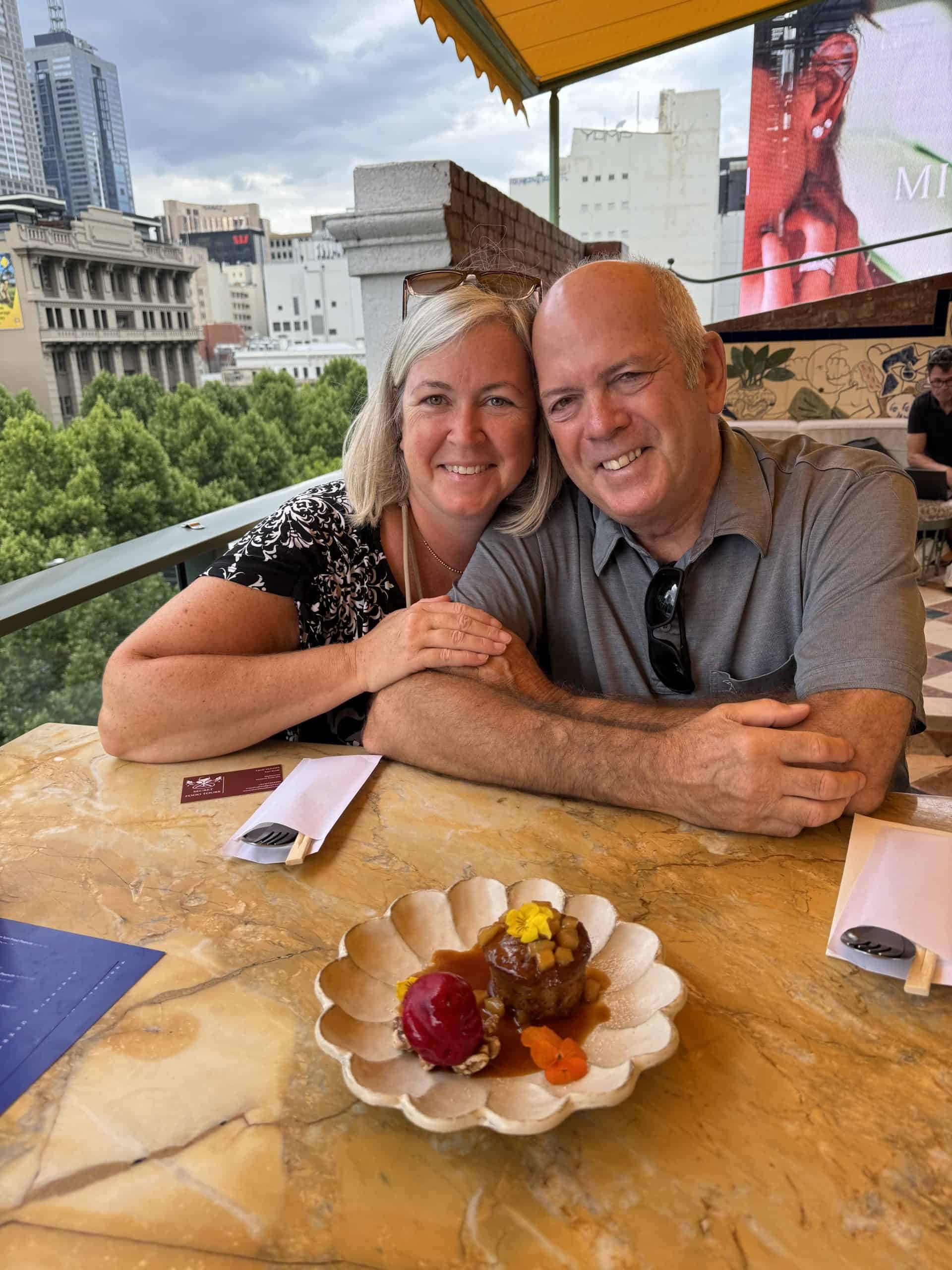 Our photo on a roof top patio before enjoying cake
