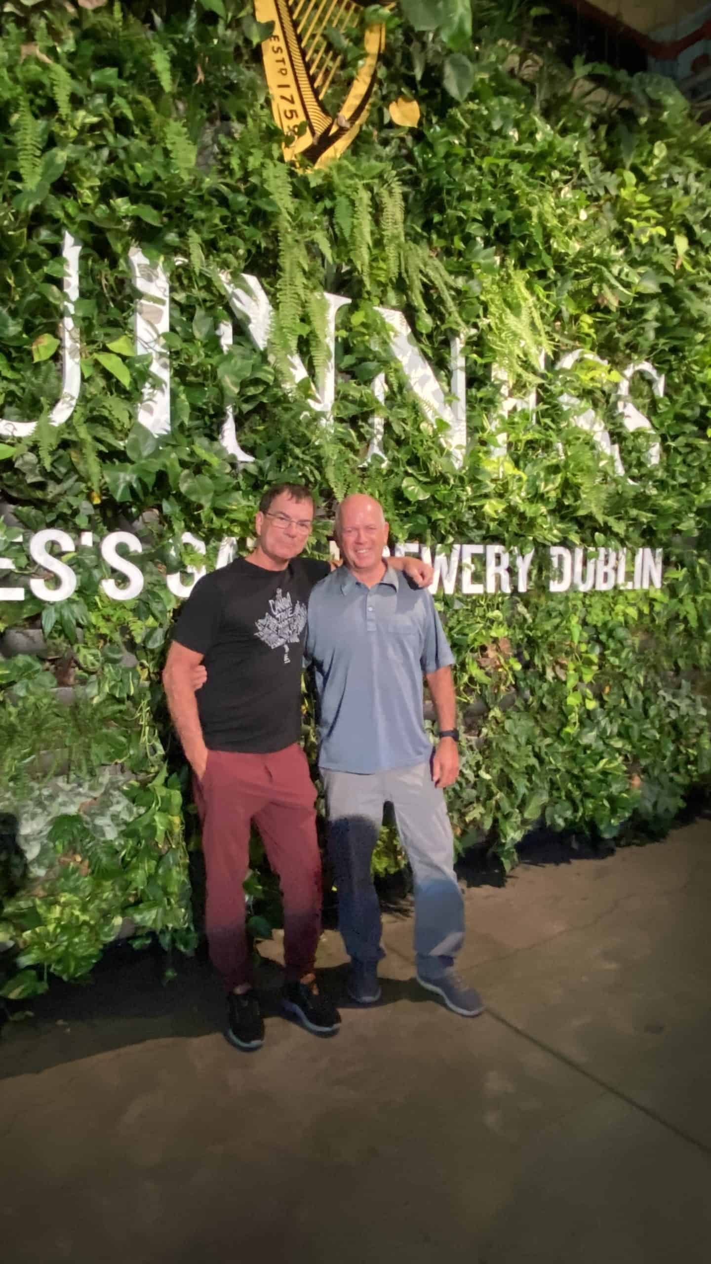 John and Denis in front of the Guinness Green wall