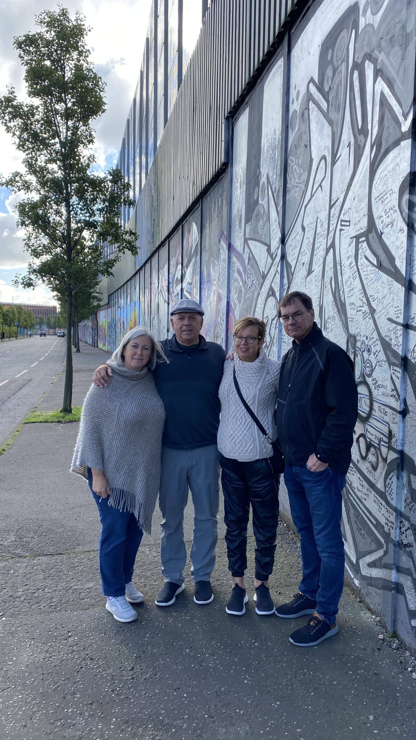 Our photo in front of the Peace Wall