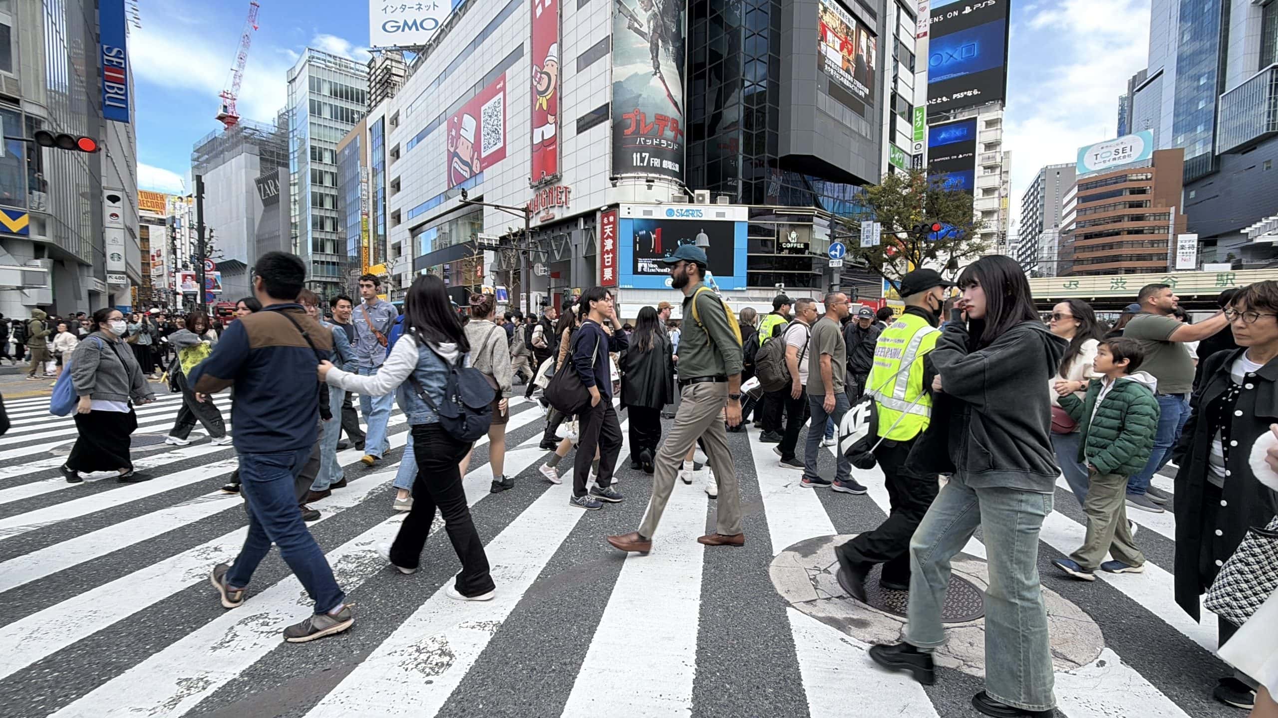 Crossing the intersection at Shibuya Crossing
