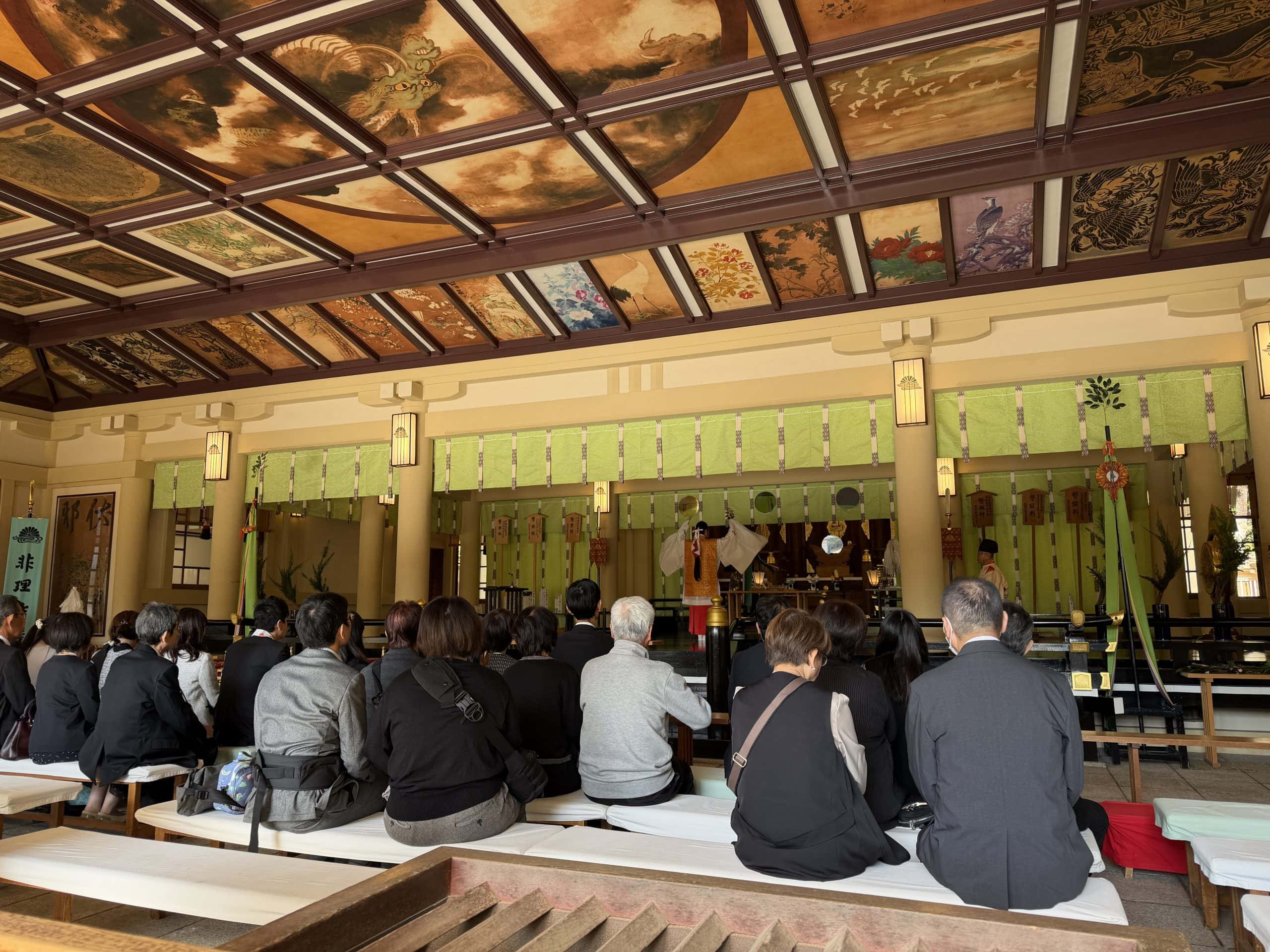 People receiving blessings inside the Main Hall