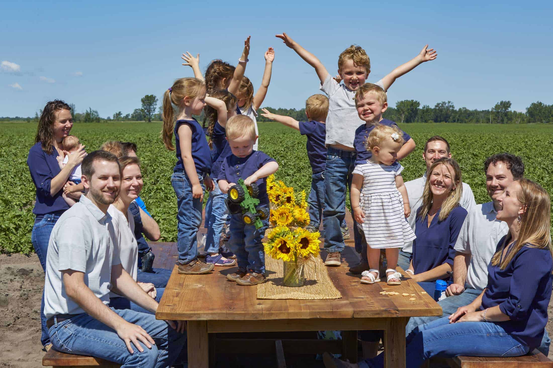Wysocki Family of Companies family having fun at picnic table in the field