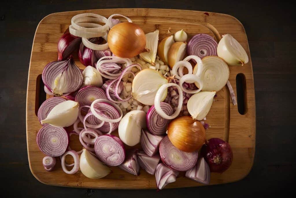 Variety of chopped onions on a cutting board