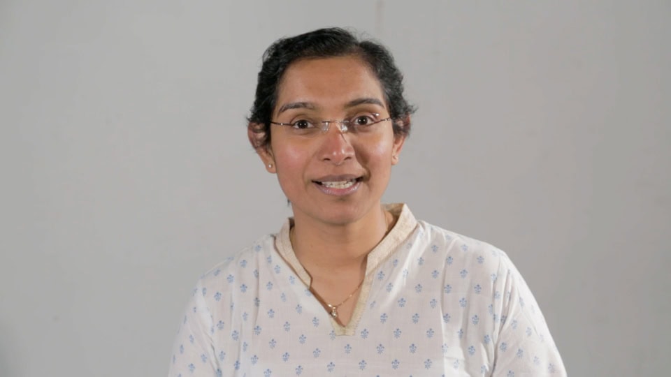 Indian woman giving an interview for Film Division videos on Indian cinema and film industry insights.