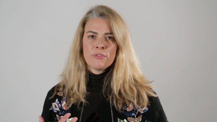 Woman speaking on camera promoting Film Division video content.