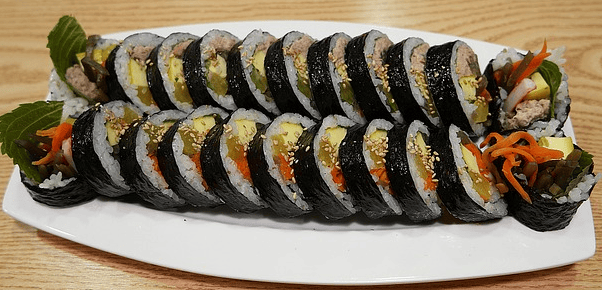 Savory Korean Tuna Kimbap filled with tuna mayo and fresh perilla leaves for a rich flavor.