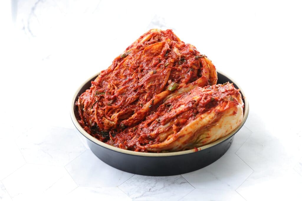 Appetizing traditional Korean napa cabbage Kimchi (Baechu-kimchi) seasoned with rich red chili flakes