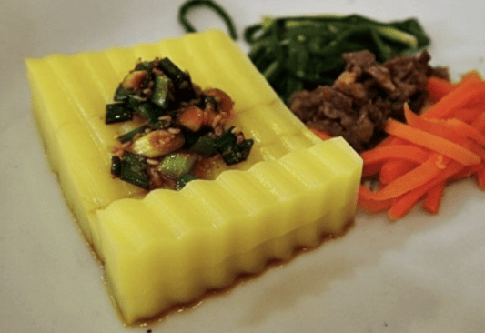 Vibrant yellow Korean mung bean jelly (Hwangpomuk) colored with gardenia fruit.