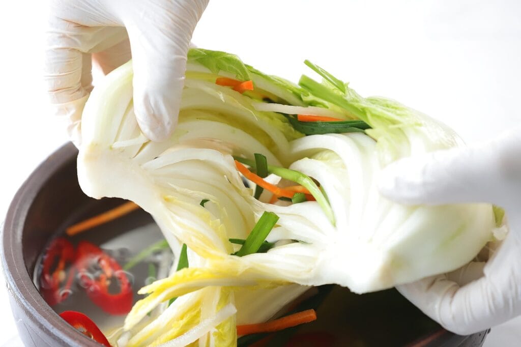 Mild and refreshing traditional Korean white kimchi (Baek-kimchi) with crunchy napa cabbage and clear broth.