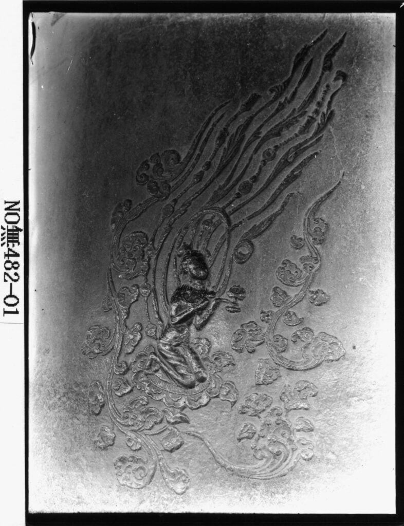 Exquisite carving of Bicheonsang (Flying Deities) on the Divine Bell of King Seongdeok, symbolizing Silla Dynasty art.