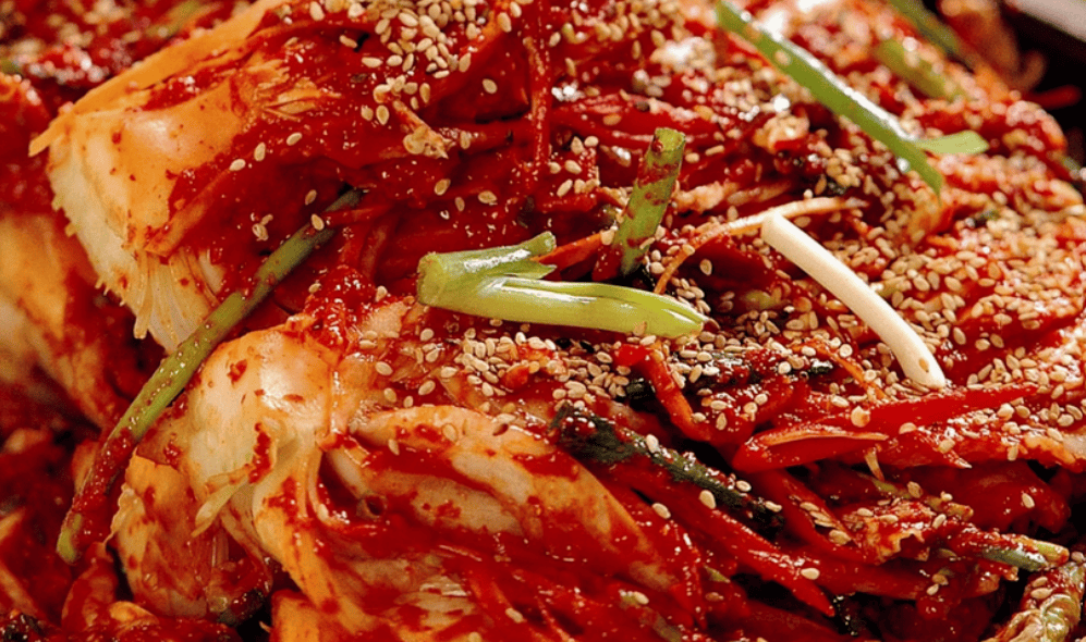 A plate of spicy, red-colored Korean Bossam Kimchi.