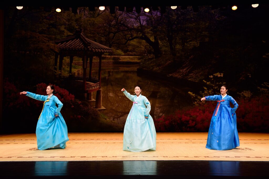 Traditional Korean Arirang performance with dancers in Hanbok, showcasing Korea's intangible cultural heritage.