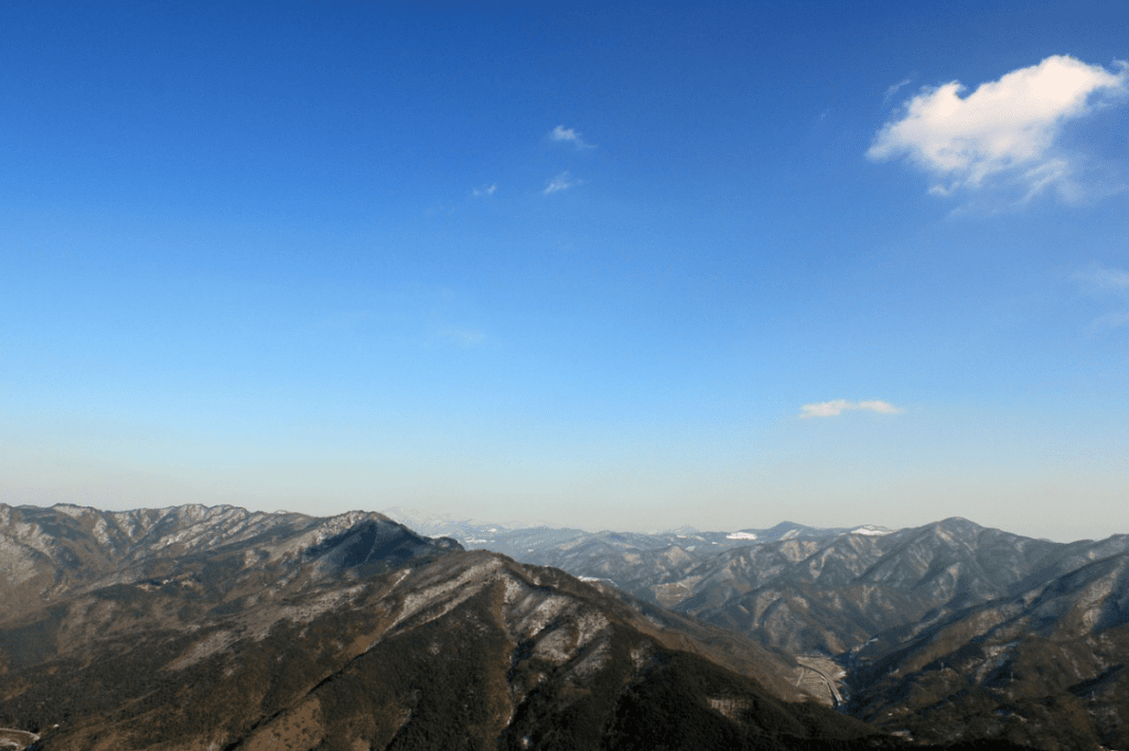 Scenic view of deep, layered mountain peaks in Korea, reflecting the soulful landscape of Jeongseon Arirang.