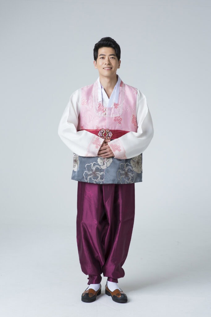 Traditional Korean men's dress (Hanbok). A classic ensemble featuring 'Baji', 'Jeogori', and an outer 'Po' (robe), showcasing the sophisticated and structured silhouette of Joseon-era fashion.