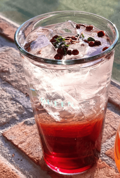 A cool glass of traditional Korean five-flavor berry tea (Omija) sparkling with soda.