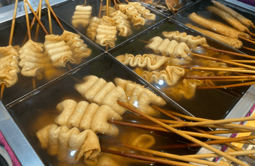 Korean fish cake skewers simmering in a hot, savory broth, a popular winter comfort food in Seoul.