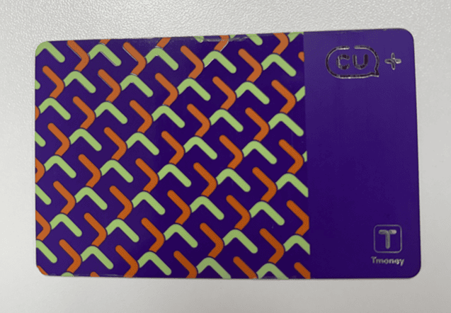 Colorful and character-themed T-money cards at a convenience store, a must-have souvenir for travelers.