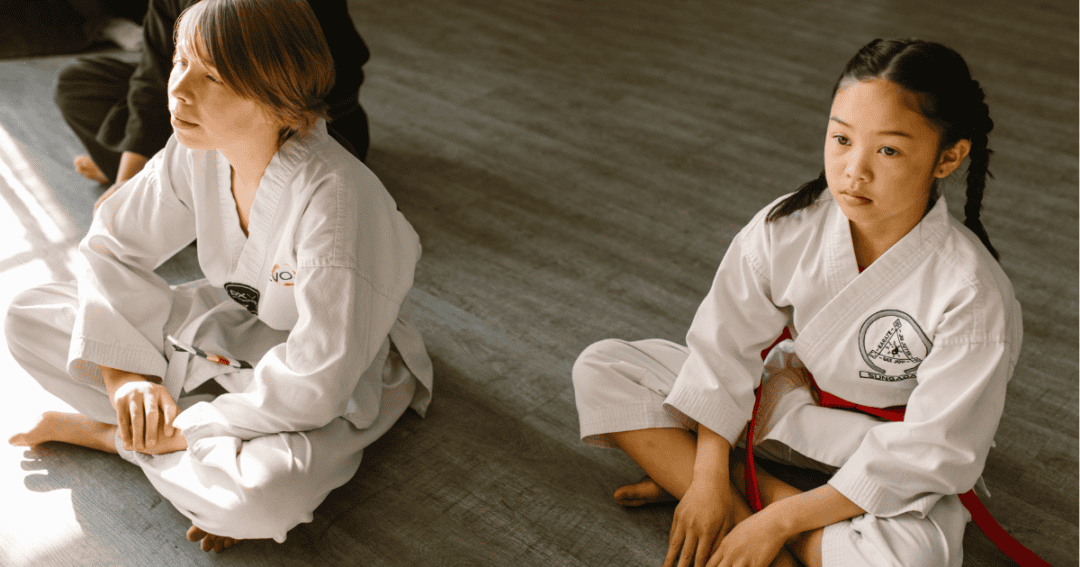 Child watching taekwando class not able to participate