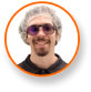 Alex Gonzalez in hair net and glasses, smiling, expert in cannabis lighting technology.