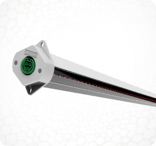 Close-up of LED grow light for cannabis with green connector, white backdrop.