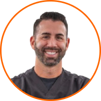 Jarrod Falite, cannabis lighting expert, in scrubs; LED grow lights background.