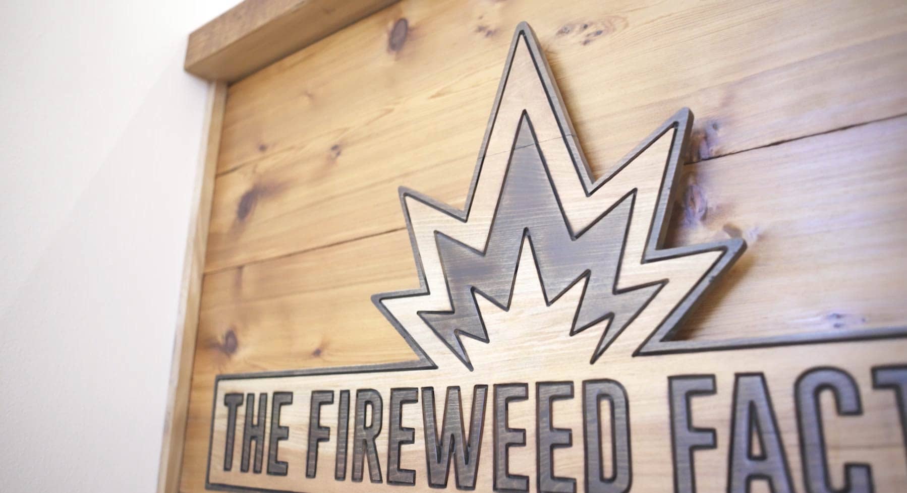 Wooden sign for Fireweed Factory, leaders in LED grow lights for cannabis.