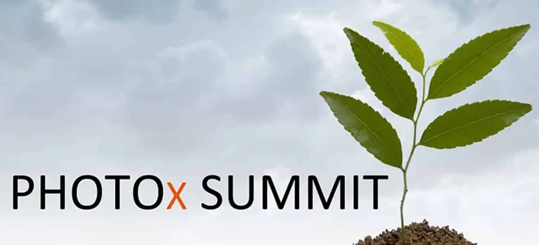 A young cannabis plant under LED grow lights, with "PHOTOx SUMMIT" text above.