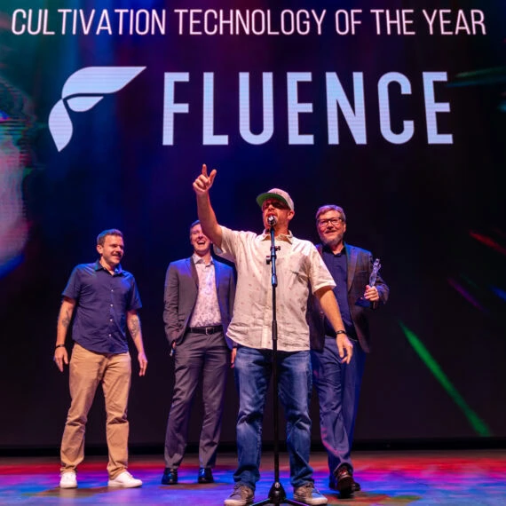 Four men celebrate cannabis lighting technology with Fluence LED grow lights award.