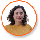 A woman in a yellow sweater with curly hair, orange border, cannabis grow lights expert.