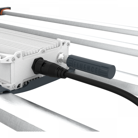 Close-up of FLUENCE LED grow light for commercial cannabis cultivation, powered on.